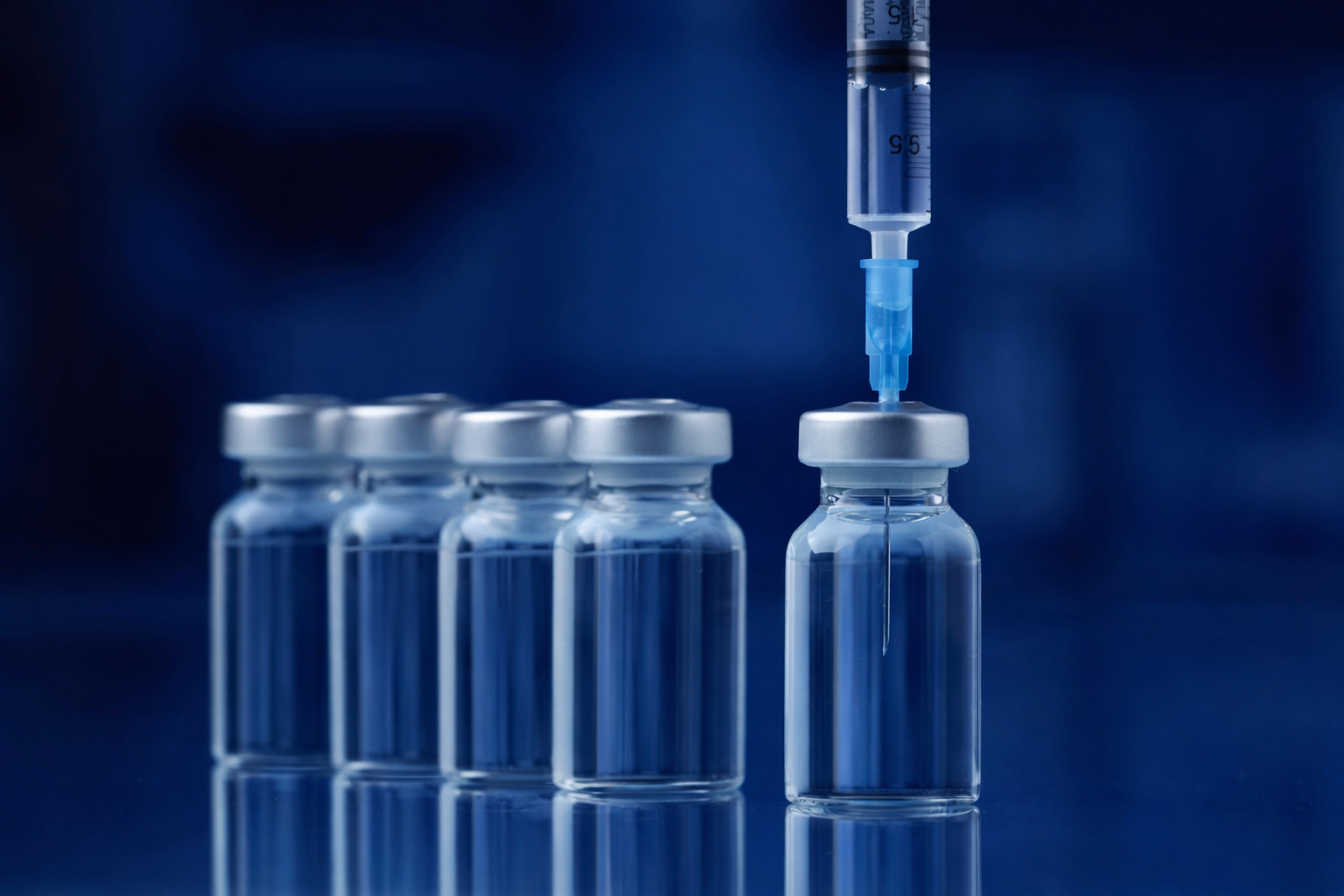 laboratory vials with syringe insertion